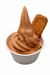 Biscoff soft serve mix served in a cup with a biscuit on top, showcasing its creamy caramel flavor.