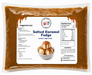 Sundae topping fudge in a pouch labeled Salted Caramel Fudge, ideal for drizzling on ice cream and desserts.
