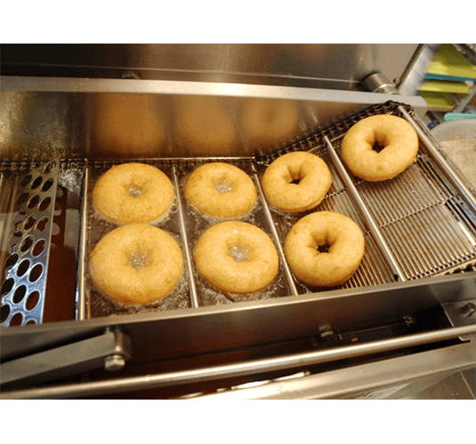 Classic Cake Donut Mix | World’s Best Tasting Donut Mix frying soft golden donuts.
