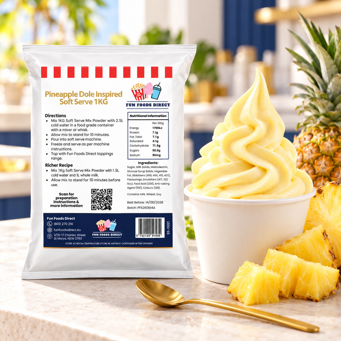 Pineapple Dole Inspired Soft Serve Mix 1kg pouch beside pineapple soft serve and cut pineapple at a counter