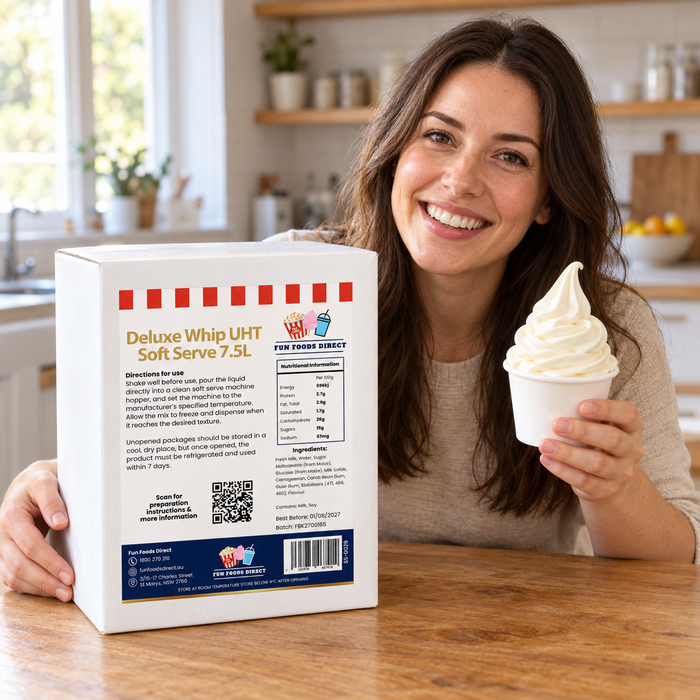 Woman holding vanilla soft serve beside the Deluxe Whip UHT Soft Serve 7.5L box